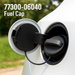 A Toyota Lexus Scion Fuel Tank Gas Cap 77300-06040  with its cover open, inserted into a white vehicle's fuel port. White text in the top left reads '77300-06040 Fuel Cap'.