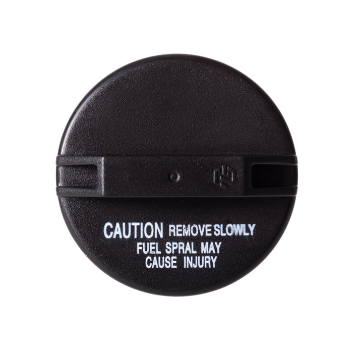 A black circular Toyota 77310-12140 Fuel Cap with white warning text reading 'CAUTION REMOVE SLOWLY FUEL SPRAL MAY CAUSE INJURY' on a plain white background.