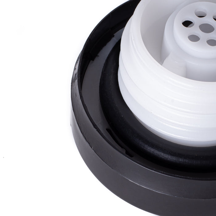 Close-up of a black Toyota 77310-12140 Fuel Cap with a white threaded plastic insert on a white background.