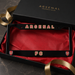 Arsenal FC license plate frame with red text and logo on a black background