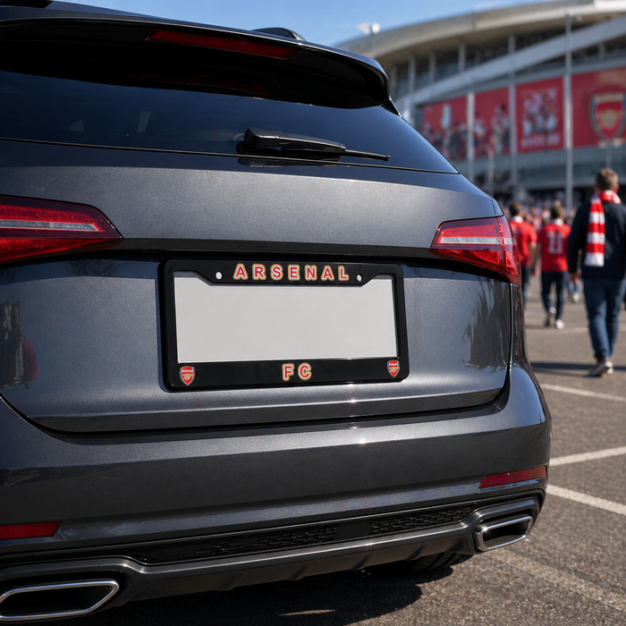 Car with Arsenal FC license plate in front of a stadium