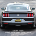 Rear view of a dark gray Mustang with a custom black license plate frame cover installed, featuring an Auburn Tigers themed California license plate. Text overlay at the bottom reads 'AUBURN TIGERS LICENSE PLATE FRAME COVER - BLACK' with 'EliteAuto' branding.