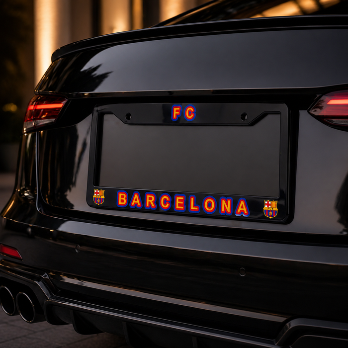 Car license plate with 'FC Barcelona' text and logo on a dark background