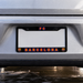 Car license plate frame with FC Barcelona logo on a silver car