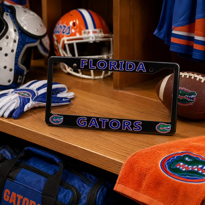 A black Florida Gators license plate frame displayed on a wooden shelf among football-themed items, including a helmet, gloves, football, towel, and bag.