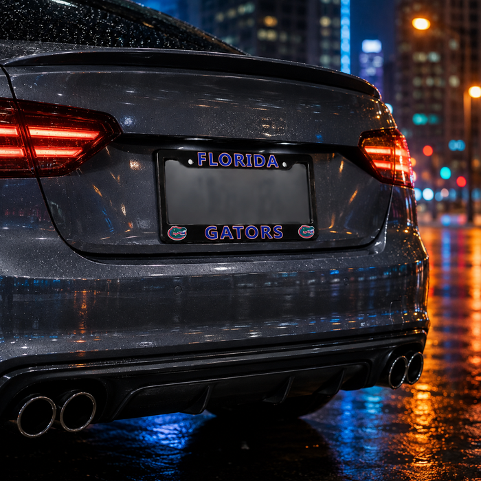 A close-up rear view of a dark gray car on a wet city street at night, featuring a custom license plate frame with the word 'FLORIDA' at the top and 'GATORS' in purple with gator logo accents at the bottom.