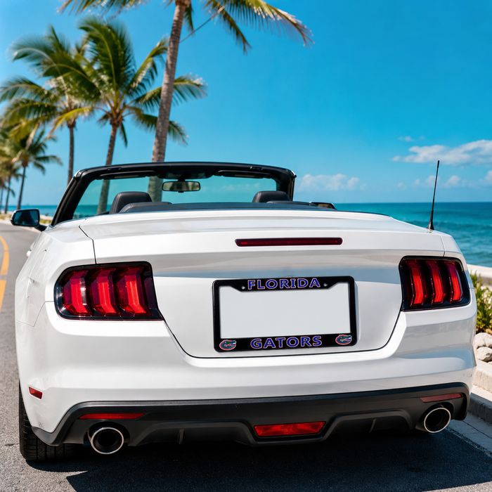 A white convertible Ford Mustang is shown from the rear on a coastal road with palm trees and the ocean in the background. The license plate frame reads 'FLORIDA GATORS' in purple and white.