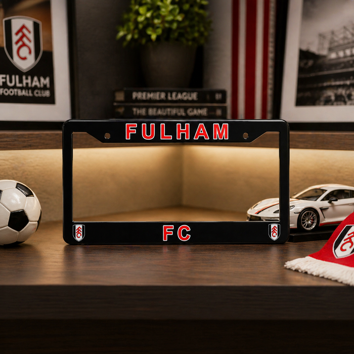 Fulham FC license plate frame on a wooden surface with football-themed decor.
