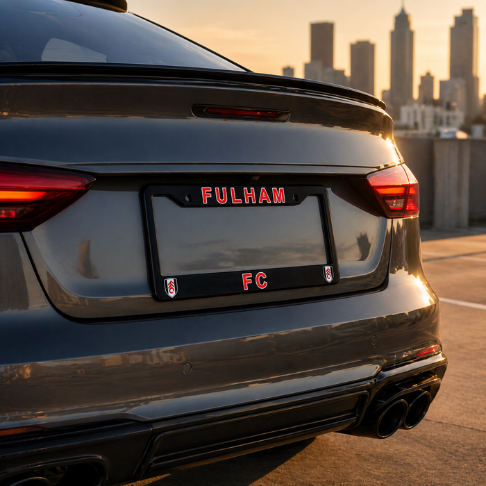 Car with 'FULHAM FC' license plate in an urban setting