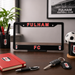 Fulham FC license plate frame on a desk with stationery items.