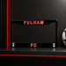 Black license plate frame with 'FULHAM FC' text on a dark background