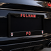 Black license plate frame with 'FULHAM FC' text on a black car.