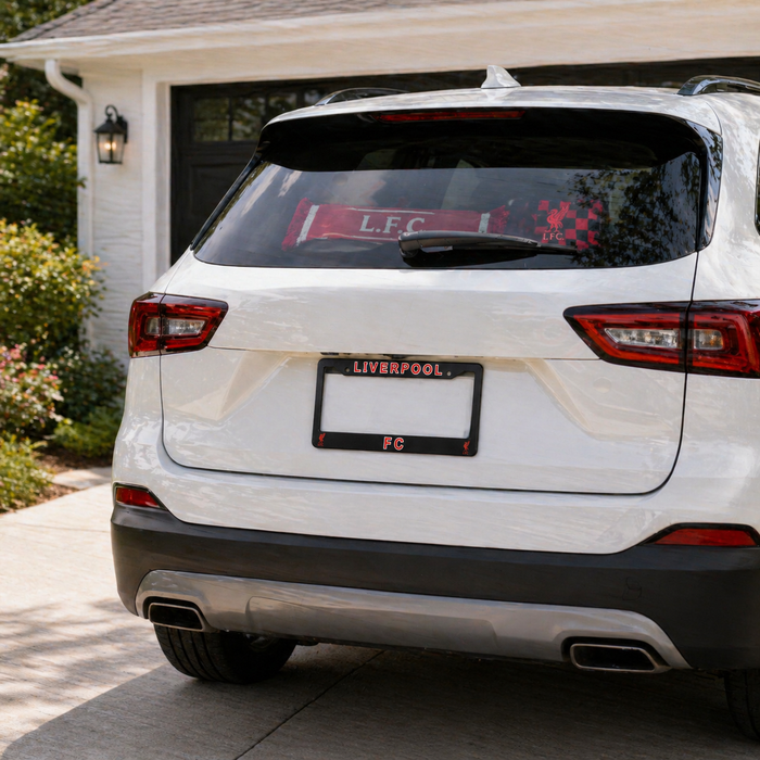 White SUV with a Liverpool FC license plate in front of a house