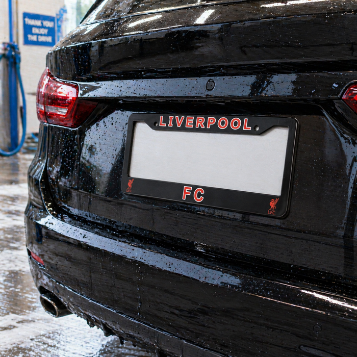 Black car with a Liverpool FC license plate in a car wash.