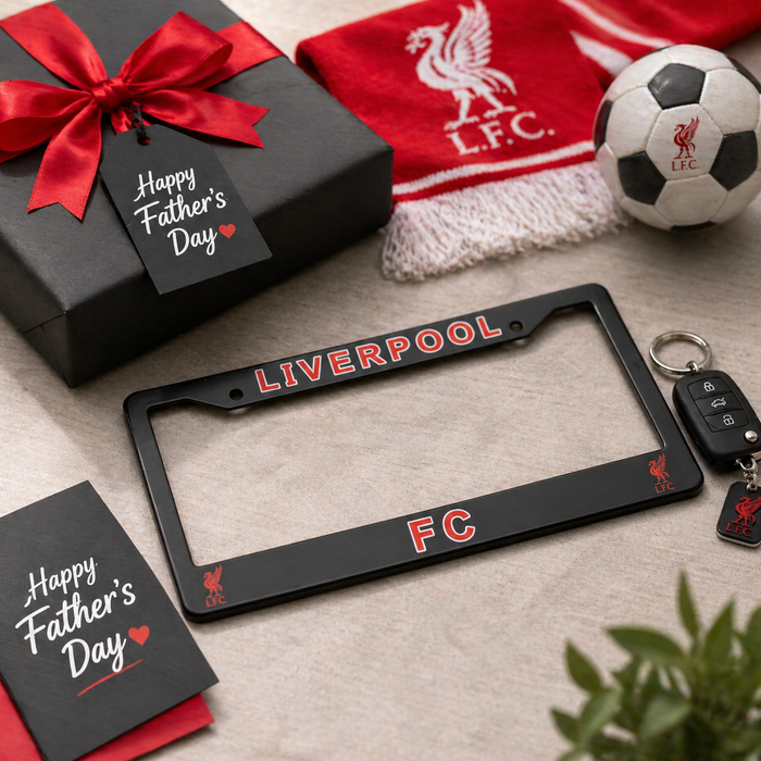 Gift set with Liverpool FC license plate frame, soccer ball, and 'Happy Father's Day' card on a textured surface.
