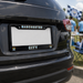 Black car with Manchester City license plate frame outdoors
