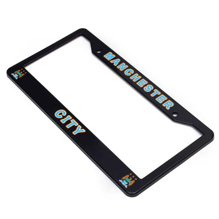 Black license plate frame with 'Manchester City' text on a white background