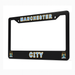 Black license plate frame with 'Manchester City' text and logo on a white background