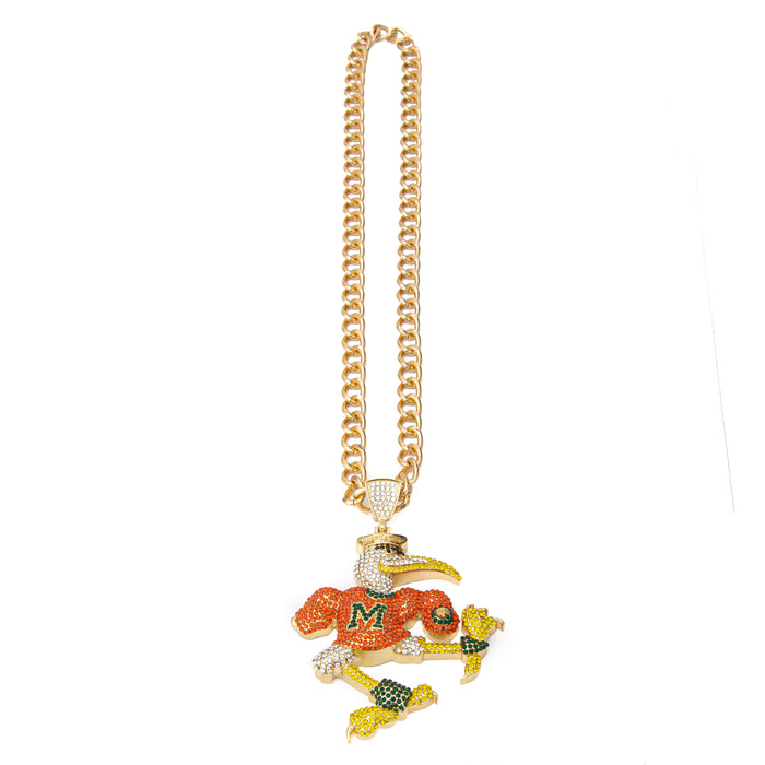A gold-toned chain necklace featuring a detailed eagle pendant adorned with rhinestones and a bright orange chest patch displaying the letter 'M'.