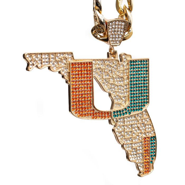 Gold-tone Florida state pendant necklace paved with clear rhinestones, featuring orange and teal accent stones, shown on a white background.