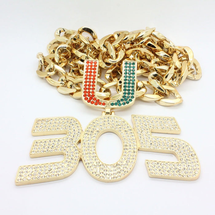 A gold-toned chunky chain necklace with a large '305' pendant and a 'UJ' initial pendant embellished with red and green rhinestones, set against a plain white background.