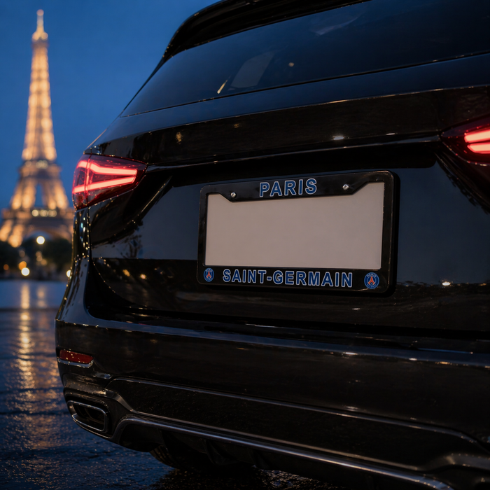 Black car with 'PARIS SAINT-GERMAIN' license plate in front of the Eiffel Tower at night.