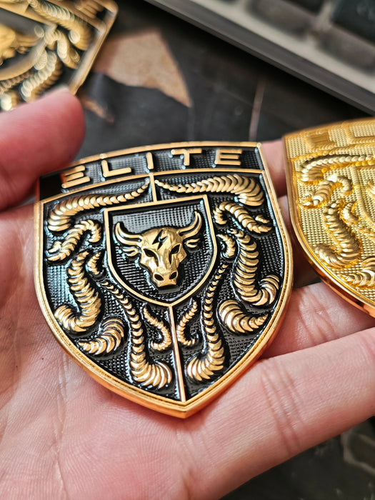 Real life image of the Black & Gold Elite Porsche Hood Emblem held in hand