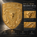 A large ornate gold porsche emblem reading ELITE, shown on a dark background with marketing text and inset close-ups. The emblem features a bull head and crumrine designs, presented as a premium gold finish product graphic.