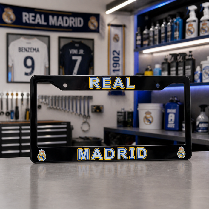 Real Madrid license plate frame on a workbench with sports-themed decor in the background